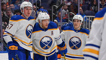 Dec 30, 2021; Elmont, New York, USA; Buffalo Sabres left wing Brett Murray (57) celebrates the goal by Buffalo Sabres right wing Kyle Okposo (21) against the New York Islanders during the first period at UBS Arena. Mandatory Credit: Dennis Schneidler-USA TODAY Sports