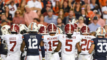 Nov 30, 2019; Auburn, AL, USA; Players look on after a collision between Alabama Crimson Tide defensive back Trevon Diggs (7) and Auburn Tigers wide receiver Seth Williams (18) during the fourth quarter at Jordan-Hare Stadium. Mandatory Credit: John David Mercer-USA TODAY Sports