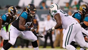 EAST RUTHERFORD, NJ - AUGUST 11: A.J. Cann #60 of the Jacksonville Jaguars in action against Jarvis Jenkins #98 of the New York Jets during the first quarter of an NFL preseason game at MetLife Stadium on August 11, 2016 in East Rutherford, New Jersey. (Photo by Rich Schultz/Getty Images)