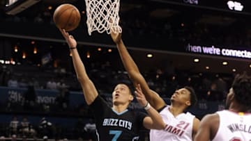 Apr 23, 2016; Charlotte, NC, USA; Charlotte Hornets guard Jeremy Lin (7) drives to the basket as he is defended by Mimami Heat center Hassan Whiteside (21) during the first half in game three of the first round of the NBA Playoffs at Time Warner Cable Arena. Mandatory Credit: Sam Sharpe-USA TODAY Sports