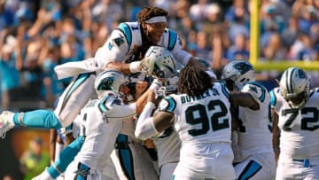 CHARLOTTE, NC - OCTOBER 07: Cam Newton #1 and teammates pile on kicker Graham Gano #9 of the Carolina Panthers after his game-winning 63-yard field goal against the New York Giants during their game at Bank of America Stadium on October 7, 2018 in Charlotte, North Carolina. The Panthers won 33-31. (Photo by Grant Halverson/Getty Images)