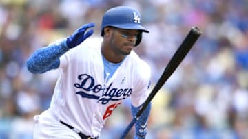 LOS ANGELES, CA - JUNE 17: Yasiel Puig #66 of the Los Angeles Dodgers slaps his bat after flying out in the second inning against the San Francisco Giants at Dodger Stadium on June 17, 2018 in Los Angeles, California. (Photo by John McCoy/Getty Images)