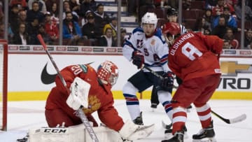 VANCOUVER, BC - JANUARY 4: Goalie Pyotr Kochetkov #20 of Russia makes a save as Jason Robertson #15 of the United States and Saveli Olshanski #8 of Russia battle in front of the goal in Semifinals hockey action of the 2019 IIHF World Junior Championship on January, 4, 2019 at Rogers Arena in Vancouver, British Columbia, Canada. (Photo by Rich Lam/Getty Images)