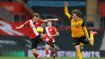 Southampton's English midfielder James Ward-Prowse (L) vies with Wolverhampton Wanderers' Portuguese striker Fabio Silva (R) during the English Premier League football match between Southampton and Wolverhampton Wanderers at St Mary's Stadium in Southampton, southern England on February 14, 2021. (Photo by Richard Heathcote / POOL / AFP) / RESTRICTED TO EDITORIAL USE. No use with unauthorized audio, video, data, fixture lists, club/league logos or 'live' services. Online in-match use limited to 120 images. An additional 40 images may be used in extra time. No video emulation. Social media in-match use limited to 120 images. An additional 40 images may be used in extra time. No use in betting publications, games or single club/league/player publications. / (Photo by RICHARD HEATHCOTE/POOL/AFP via Getty Images)