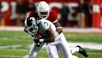 PISCATAWAY, NJ - NOVEMBER 25: K.J. Gray #17 of the Rutgers Scarlet Knights takes down LJ Scott #3 of the Michigan State Spartans during their game on November 25, 2017 in Piscataway, New Jersey. (Photo by Jeff Zelevansky/Getty Images)