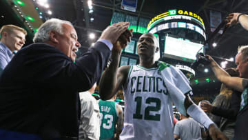 BOSTON - MAY 9: Boston Celtics' Terry Rozier III high-fives a fan as he heads for the locker room following Boston's 114-112 victory. The Boston Celtics host the Philadelphia 76ers in Game Five of the NBA Eastern Conference Semi Final playoff series at TD Garden in Boston on May 9, 2018. (Photo by Jim Davis/The Boston Globe via Getty Images)