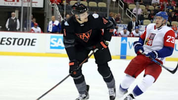 Sep 14, 2016; Pittsburgh, PA, USA; Team North America defenseman Colton Parayko (4) handles the puck ahead of Team Czech Republic forward Dmitrij Jaskin (23) during the second period in a World Cup of Hockey pre-tournament game at CONSOL Energy Center. Mandatory Credit: Charles LeClaire-USA TODAY Sports