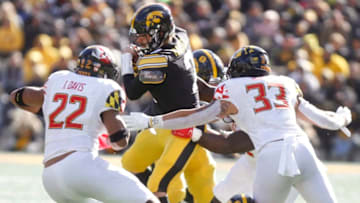IOWA CITY, IOWA- OCTOBER 20: Quarterback Peyton Mansell #2 of the Iowa Hawkeyes runs up the field on a keeper during the second half in front of linebackers Isaiah Davis #22 and Tre Watson #33 of the Maryland Terrapins on October 20, 2018 at Kinnick Stadium, in Iowa City, Iowa. (Photo by Matthew Holst/Getty Images)