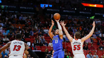 Feb 15, 2022; Miami, Florida, USA; Dallas Mavericks guard Jalen Brunson (13) shoots the basketball over Miami Heat guard Duncan Robinson (55) during the first quarter at FTX Arena. Mandatory Credit: Sam Navarro-USA TODAY Sports