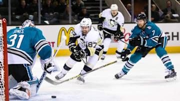 Dec 1, 2015; San Jose, CA, USA; Pittsburgh Penguins center Sidney Crosby (87) shoots against the San Jose Sharks in the first period at SAP Center at San Jose. Mandatory Credit: John Hefti-USA TODAY Sports.