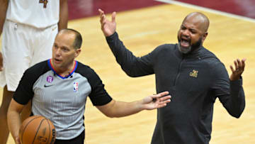Apr 26, 2023; Cleveland, Ohio, USA; Cleveland Cavaliers head coach J. B. Bickerstaff reacts beside referee John Goble (10) in the fourth quarter during game five of the 2023 NBA playoffs against the New York Knicks at Rocket Mortgage FieldHouse. Mandatory Credit: David Richard-USA TODAY Sports
