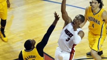 May 24, 2014; Miami, FL, USA; Miami Heat guard Dwyane Wade (3) takes a shot against Indiana Pacers center Ian Mahinmi (28) in game three of the Eastern Conference Finals of the 2014 NBA Playoffs at American Airlines Arena. Mandatory Credit: Robert Mayer-USA TODAY Sports