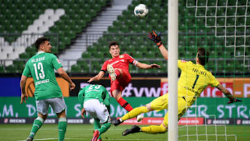 Leverkusen's German midfielder Kai Havertz (C) scores the opening goal during the German first division Bundesliga football match Werder Bremen v Bayer 04 Leverkusen on May 18, 2020 in Bremen, northern Germany as the season resumed following a two-month absence due to the novel coronavirus COVID-19 pandemic. (Photo by Stuart FRANKLIN / POOL / AFP) / DFL REGULATIONS PROHIBIT ANY USE OF PHOTOGRAPHS AS IMAGE SEQUENCES AND/OR QUASI-VIDEO (Photo by STUART FRANKLIN/POOL/AFP via Getty Images)