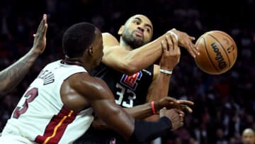 Miami Heat center Bam Adebayo (13) and Los Angeles Clippers forward Nicolas Batum (33) reach for a rebound(Jayne Kamin-Oncea-USA TODAY Sports)