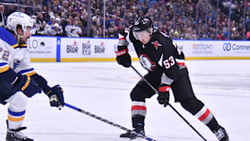 Nov 23, 2022; Buffalo, New York, USA; Buffalo Sabres left wing Jeff Skinner (53) works the puck to score a goal in the second period as St. Louis Blues defenseman Justin Faulk (72) defends at KeyBank Center. Mandatory Credit: Mark Konezny-USA TODAY Sports