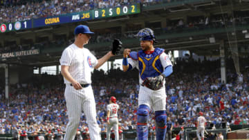 CHICAGO, ILLINOIS - SEPTEMBER 20: Alec Mills #30 of the Chicago Cubs fist bumps Willson Contreras #40 after the third inning against the St. Louis Cardinals at Wrigley Field on September 20, 2019 in Chicago, Illinois. (Photo by Nuccio DiNuzzo/Getty Images)