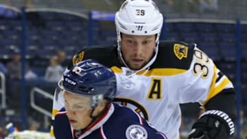 Oct 6, 2016; Columbus, OH, USA; Boston Bruins left wing Matt Beleskey (39) collides with Columbus Blue Jackets defenseman Markus Nutivaara (65) in the first period during a preseason hockey game at Nationwide Arena. Mandatory Credit: Aaron Doster-USA TODAY Sports