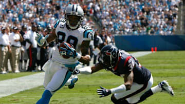 CHARLOTTE, NC - SEPTEMBER 16: Receiver Steve Smith #89 of the Carolina Panthers scores a touchdown past free safety Von Hutchins #34 of the Houston Texans during the Texans 34-21 win at Bank of America Stadium on September 16, 2007 in Charlotte, North Carolina. (Photo by Kevin C. Cox/Getty Images)