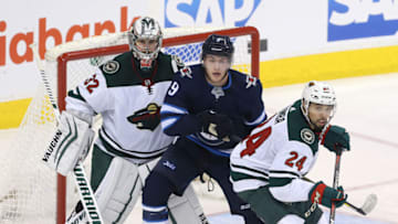Matt Dumba, right, and the Minnesota Wild face Winnipeg on Tuesday, the first matchup between the teams since Jan 2020. (Photo by Jason Halstead /Getty Images)
