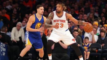 Jan 31, 2016; New York, NY, USA; New York Knicks power forward Derrick Williams (23) controls the ball against Golden State Warriors shooting guard Klay Thompson (11) during the second quarter at Madison Square Garden. The Warriors defeated the Knicks 116-95. Mandatory Credit: Brad Penner-USA TODAY Sports
