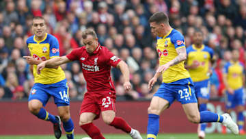 LIVERPOOL, ENGLAND - SEPTEMBER 22: Xherdan Shaqiri of Liverpool is challenged by Pierre-Emile Hojbjerg of Southampton during the Premier League match between Liverpool FC and Southampton FC at Anfield on September 22, 2018 in Liverpool, United Kingdom. (Photo by Alex Livesey/Getty Images)
