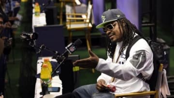 Jan 27, 2015; Phoenix, AZ, USA; Seattle Seahawks running back Marshawn Lynch sits at his podium during media day for Super Bowl XLIX at US Airways Center. Mandatory Credit: Kyle Terada-USA TODAY Sports