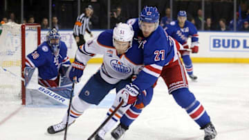 Nov 3, 2016; New York, NY, USA; Edmonton Oilers center Anton Lander (51) and New York Rangers defenseman Ryan McDonagh (27) fight for the puck during the third period at Madison Square Garden. Mandatory Credit: Brad Penner-USA TODAY Sports