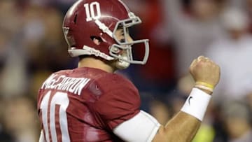 Nov 9, 2013; Tuscaloosa, AL, USA; Alabama Crimson Tide quarterback AJ McCarron (10) celebrates after a touchdown against the LSU Tigers during the fourth quarter at Bryant-Denny Stadium. Alabama defeated LSU 38-17. Mandatory Credit: John David Mercer-USA TODAY Sports