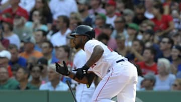 Sep 7, 2015; Boston, MA, USA; Boston Red Sox right fielder Jackie Bradley Jr. (25) hits an RBI single during the fourth inning against the Toronto Blue Jays at Fenway Park. Mandatory Credit: Bob DeChiara-USA TODAY Sports