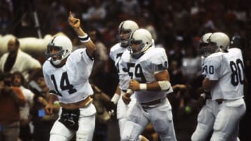Jan 1, 1983, New Orleans, LA, USA; FILE PHOTO; Penn State Nittany Lions quarterback Todd Blackledge (14) celebrates on the field against the Georgia Bulldogs at the Superdome during the 1983 Sugar Bowl. The Nittany Lions defeated the Bulldogs 27-23 to win the National Championship. Mandatory Credit: Malcolm Emmons-USA TODAY Sports