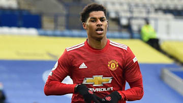 Manchester United's English striker Marcus Rashford celebrates after scoring the opening goal during the English Premier League football match between Leicester City and Manchester United at King Power Stadium in Leicester, central England on December 26, 2020. (Photo by Glyn KIRK / POOL / AFP) / RESTRICTED TO EDITORIAL USE. No use with unauthorized audio, video, data, fixture lists, club/league logos or 'live' services. Online in-match use limited to 120 images. An additional 40 images may be used in extra time. No video emulation. Social media in-match use limited to 120 images. An additional 40 images may be used in extra time. No use in betting publications, games or single club/league/player publications. / (Photo by GLYN KIRK/POOL/AFP via Getty Images)