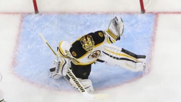 Feb 26, 2016; Raleigh, NC, USA; Boston Bruins goalie Tuukka Rask (40) reaches to make a glove save against the Carolina Hurricanes at PNC Arena. The Boston Bruins defeated the Carolina Hurricanes 4-1. Mandatory Credit: James Guillory-USA TODAY Sports