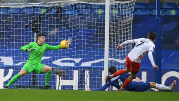 Chelsea's Spanish goalkeeper Kepa Arrizabalaga (L) saves this attempt from Luton Town's English striker Harry Cornick (R) during the English FA Cup fourth round football match between Chelsea and Luton Town at Stamford Bridge in London on January 24, 2021. (Photo by DANIEL LEAL-OLIVAS / AFP) / RESTRICTED TO EDITORIAL USE. No use with unauthorized audio, video, data, fixture lists, club/league logos or 'live' services. Online in-match use limited to 120 images. An additional 40 images may be used in extra time. No video emulation. Social media in-match use limited to 120 images. An additional 40 images may be used in extra time. No use in betting publications, games or single club/league/player publications. / (Photo by DANIEL LEAL-OLIVAS/AFP via Getty Images)