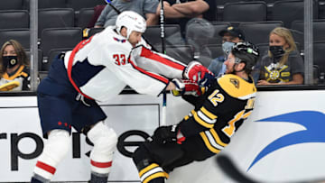 May 21, 2021; Boston, Massachusetts, USA; Washington Capitals defenseman Zdeno Chara (33) knocks down Boston Bruins right wing Craig Smith (12) during the first period in game four of the first round of the 2021 Stanley Cup Playoffs at TD Garden. Mandatory Credit: Bob DeChiara-USA TODAY Sports
