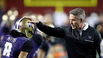 SANTA CLARA, CA - DECEMBER 02: Head coach Chris Petersen of the Washington Huskies talks to Dante Pettis