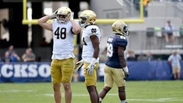 Nov 5, 2016; Jacksonville, FL, USA; Notre Dame Fighting Irish linebacker Greer Martini (48) reacts after cornerback Nick Coleman (24) was called for pass interference against Navy Midshipmen running back Darryl Bonner (29) in the fourth quarter at EverBank Field. Navy won 28-27. Mandatory Credit: Matt Cashore-USA TODAY Sports