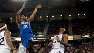 Jan 2, 2014; Sacramento, CA, USA; Philadelphia 76ers power forward Thaddeus Young (21) takes a shot over Sacramento Kings power forward Jason Thompson (34) during the second quarter at Sleep Train Arena. Mandatory Credit: Ed Szczepanski-USA TODAY Sports