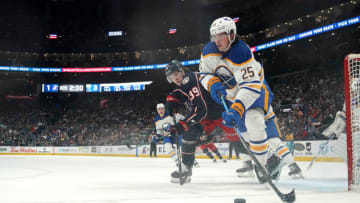 Apr 14, 2023; Columbus, Ohio, USA; Buffalo Sabres defenseman Owen Power (25) controls the puck while Columbus Blue Jackets center Tyler Angle (39) defends during the second period at Nationwide Arena. Mandatory Credit: Jason Mowry-USA TODAY Sports