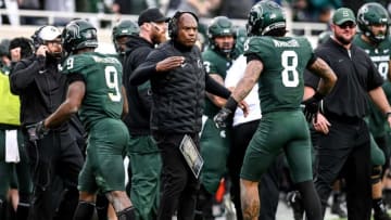 Michigan State's head coach Mel Tucker, center, celebrates with Kenneth Walker III, left, and Jalen Nailor after Walker III's touchdown against Michigan during the second quarter on Saturday, Oct. 30, 2021, at Spartan Stadium in East Lansing.211030 Msu Michigan 123a
