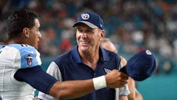 Sep 1, 2016; Miami Gardens, FL, USA; Tennessee Titans head coach Mike Mularkey (right) talks with Titans quarterback Marcus Mariota (left) during a game against the Miami Dolphins at Hard Rock Stadium. Tennessee won 21-10. Mandatory Credit: Steve Mitchell-USA TODAY Sports