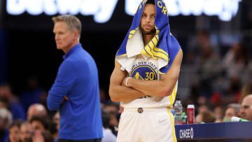 SAN FRANCISCO, CALIFORNIA - OCTOBER 28: Stephen Curry #30 of the Golden State Warriors waits to check in while head coach Steve Kerr stands on the side of the court during the second half of their game against the Memphis Grizzlies at Chase Center on October 28, 2021 in San Francisco, California. NOTE TO USER: User expressly acknowledges and agrees that, by downloading and/or using this photograph, User is consenting to the terms and conditions of the Getty Images License Agreement. (Photo by Ezra Shaw/Getty Images)