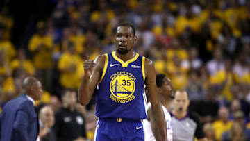 OAKLAND, CALIFORNIA - APRIL 24: Kevin Durant #35 of the Golden State Warriors reacts during their game against the LA Clippers during Game Five of the first round of the 2019 NBA Western Conference Playoffs at ORACLE Arena on April 24, 2019 in Oakland, California. NOTE TO USER: User expressly acknowledges and agrees that, by downloading and or using this photograph, User is consenting to the terms and conditions of the Getty Images License Agreement. (Photo by Ezra Shaw/Getty Images)