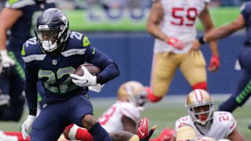 SEATTLE, WA - SEPTEMBER 17: Running back C.J. Prosise #22 of the Seattle Seahawks escapes linebacker NaVorro Bowman #53 of the San Francisco 49ers in the first quarter of the game at CenturyLink Field on September 17, 2017 in Seattle, Washington. (Photo by Stephen Brashear/Getty Images)
