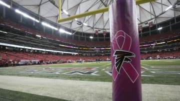 The Atlanta Falcons logo is shown on a goalpost with a pink ribbon in honor of Breast Cancer Awareness month before their game against the Chicago Bears at the Georgia Dome. Mandatory Credit: Jason Getz-USA TODAY Sports