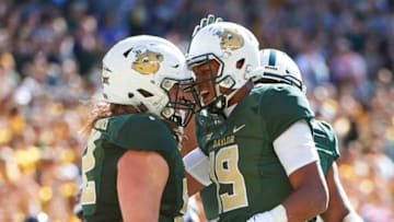 WACO, TX - NOVEMBER 3: Jalan McClendon #19 of the Baylor Bears celebrates after scoring on a 1 yard touchdown run with teammate Sam Tecklenburg #52 against the Oklahoma State Cowboys during the first half of an NCAA football game at McLane Stadium on November 3, 2018 in Waco, Texas. (Photo by Cooper Neill/Getty Images)