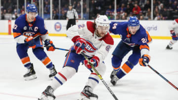 UNIONDALE, NY - MARCH 14: Montreal Canadiens Winger Jonathan Drouin (92) drives the net as New York Islanders Defenceman Scott Mayfield (24) attempts to defend during a game between the New York Islanders and the Montreal Canadiens on March 14, 2019 at the Nassau Veterans Memorial Coliseum (NYCB Live) in Uniondale, NY. (Photo by John McCreary/Icon Sportswire via Getty Images)
