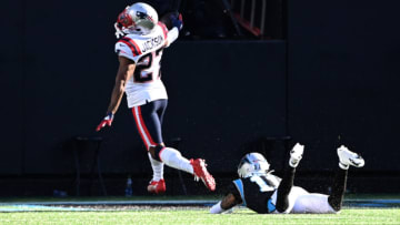 Nov 7, 2021; Charlotte, North Carolina, USA; New England Patriots cornerback J.C. Jackson (27) returns an interception for a touchdown as Carolina Panthers wide receiver Robby Anderson (11) defends in the third quarter at Bank of America Stadium. Mandatory Credit: Bob Donnan-USA TODAY Sports