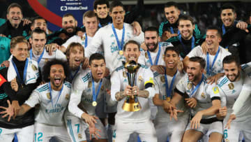 ABU DHABI, UNITED ARAB EMIRATES - DECEMBER 16: Sergio Ramos of Real Madrid lifts the trophy with his team-mates at the end of the FIFA Club World Cup UAE 2017 final match between Gremio and Real Madrid CF at Zayed Sports City Stadium on December 16, 2017 in Abu Dhabi, United Arab Emirates. (Photo by Matthew Ashton - AMA/Getty Images)
