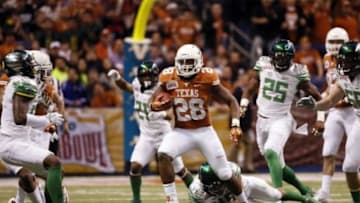 Dec 30, 2013; San Antonio, TX, USA; Texas Longhorns running back Malcolm Brown (28) runs with the ball during the first half against Oregon Ducks at Alamo Dome. Mandatory Credit: Soobum Im-USA TODAY Sports