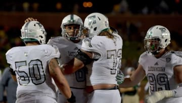 Sep 10, 2016; Columbia, MO, USA; Eastern Michigan Eagles quarterback Todd Porter (8) is congratulated by team mates after scoring during the second half against the Missouri Tigers at Faurot Field. Missouri won 61-21. Mandatory Credit: Denny Medley-USA TODAY Sports